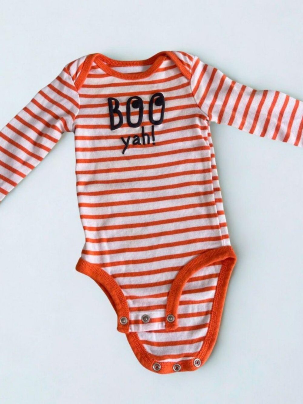 Adorable striped baby onesie with a playful 'Boo y'all' print.